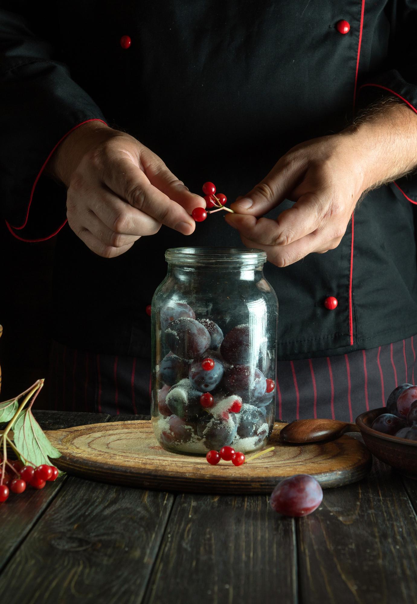 Hands preparing fermented garnish